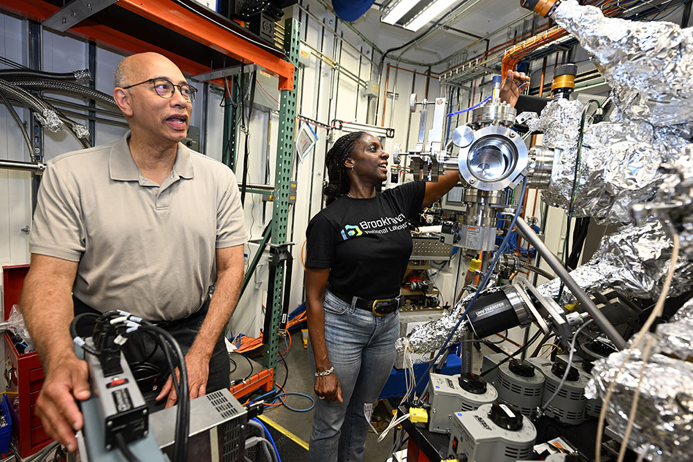 Kenneth Evans-Lutterodt and Tina Brower-Thomas with machinery