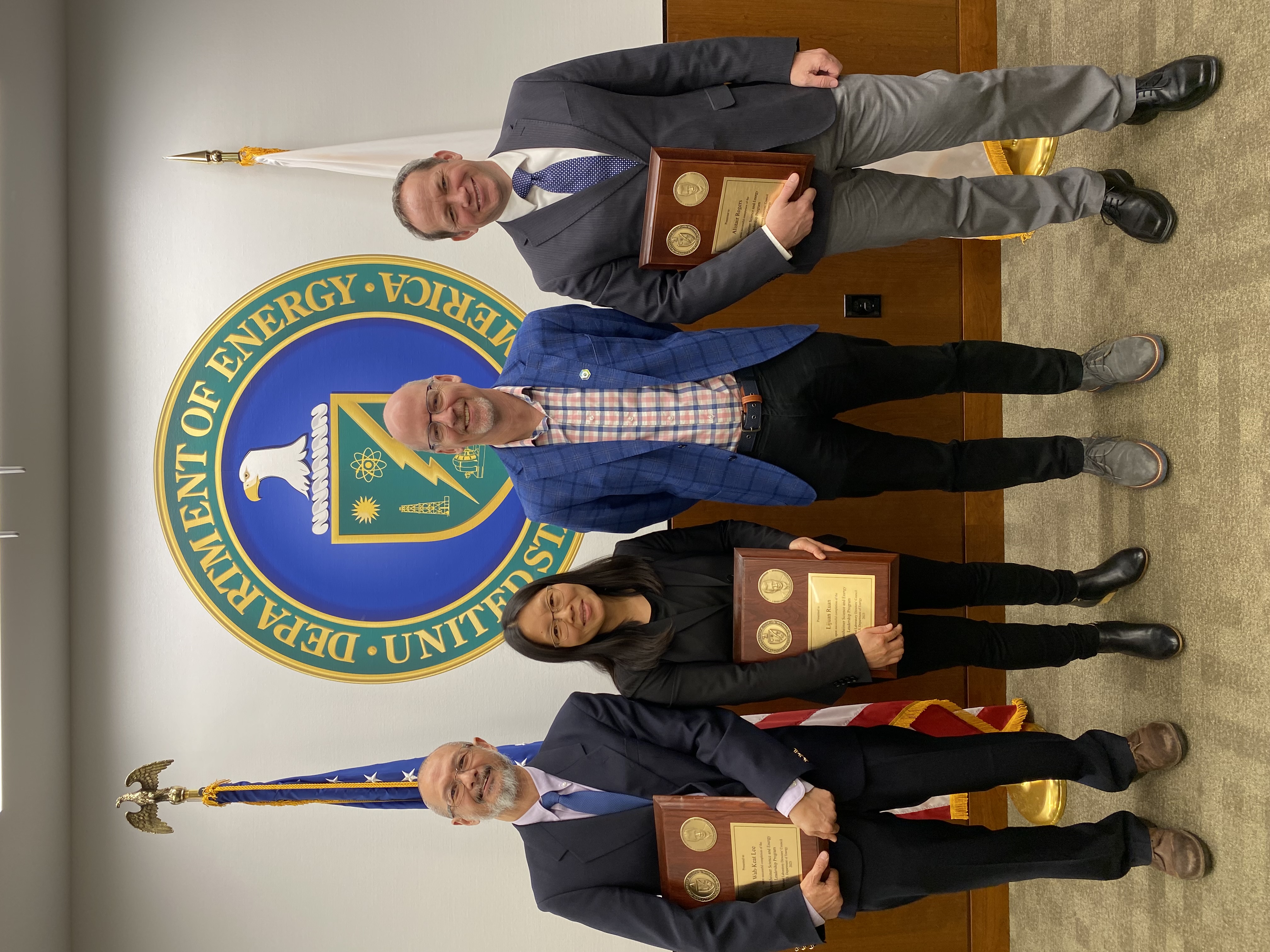 Wah-Keat Lee, Lijuan Ruan, John Hill, and Alistair Rogers (left to right) at OSLEP's capstone event in December 2023.