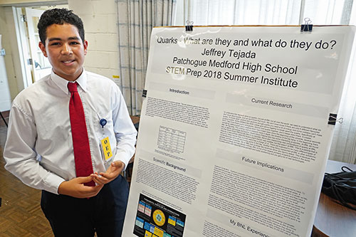 Jeffrey Tejada poses with research poster