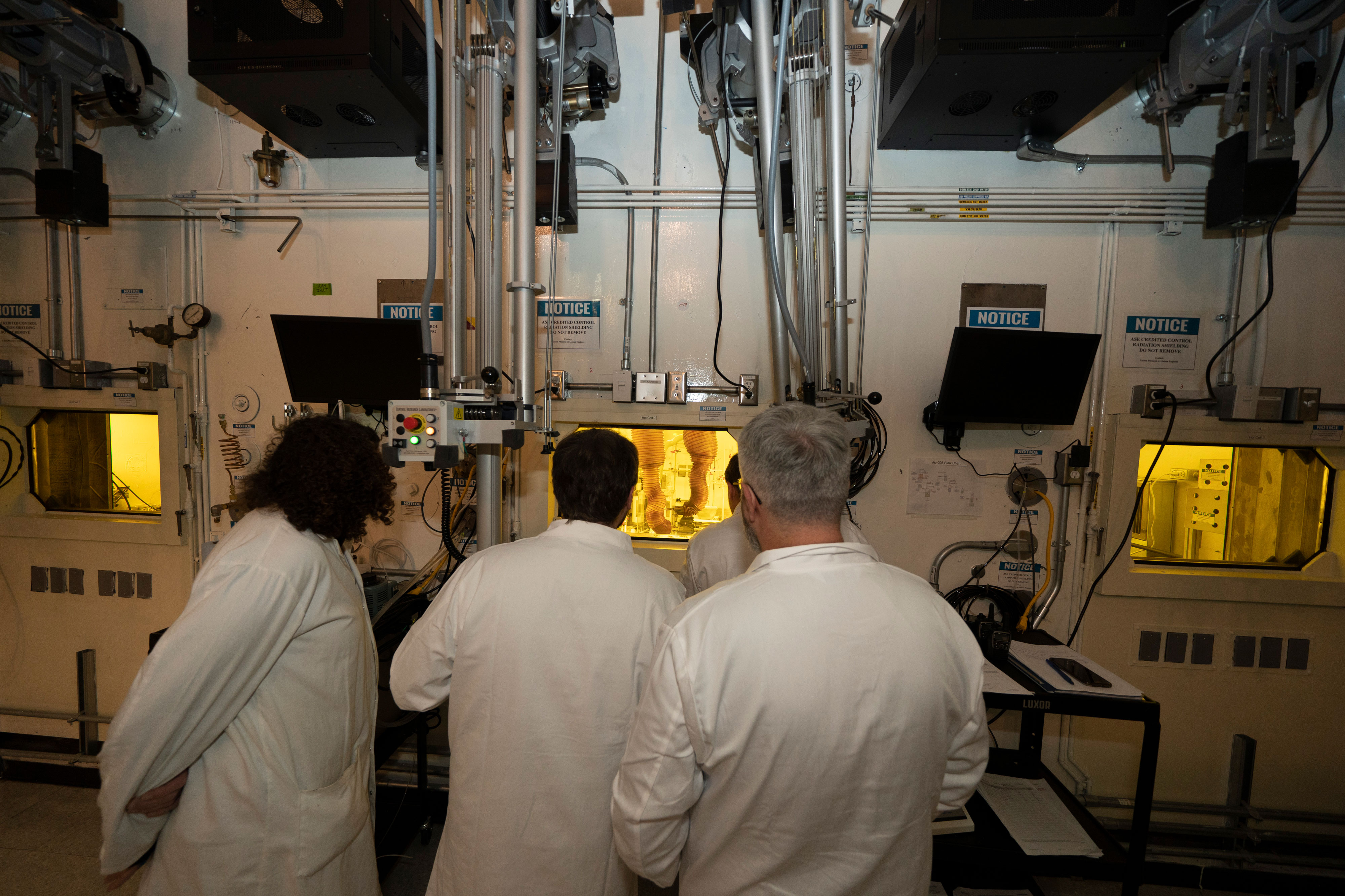 Members of Brookhaven Lab's Isotope Research and Production team in the refurbished hot-cell area used for processing targets to make medical isotopes such as actinium-225 

