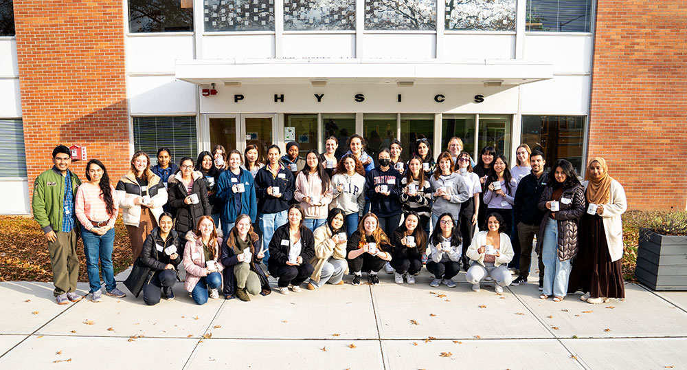 Group poses outside of Brookhaven Lab's Physics building