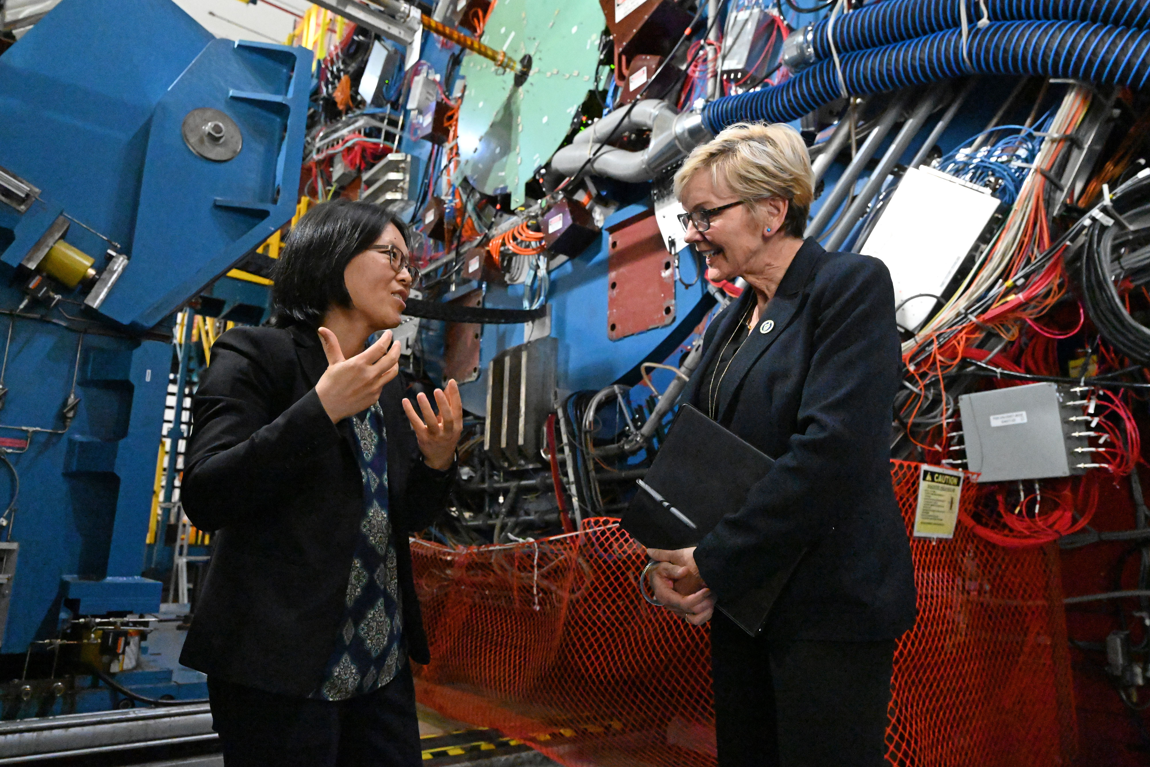 Lijuan Ruan, physicist and co-spokesperson for the STAR experiment collaboration at the Relativistic Heavy Ion Collider (RHIC), joined Secretary Granholm at the STAR detector, which tracks thousands of particles streaming out of collisions at RHIC. 