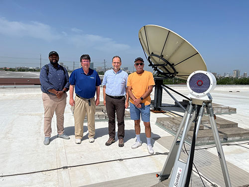 Vrinceanu, second from right, poses with TSU graduate student Aaron Taylor, TRACER PI Mike Jensen, a