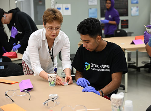 Tatiana Pyatina and student prepare cement mixture