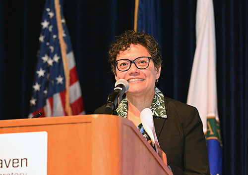 Aleida Perez speaking at a podium