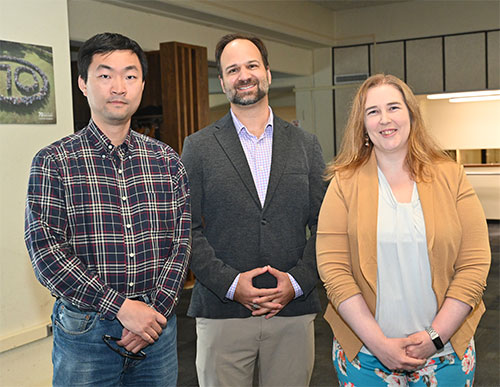 Jin Huang (left) and Megan Connors (right) with Dennis Perepelitsa (center)