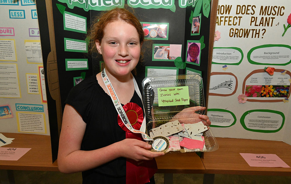 Lyla Drucker displays homemade seed paper