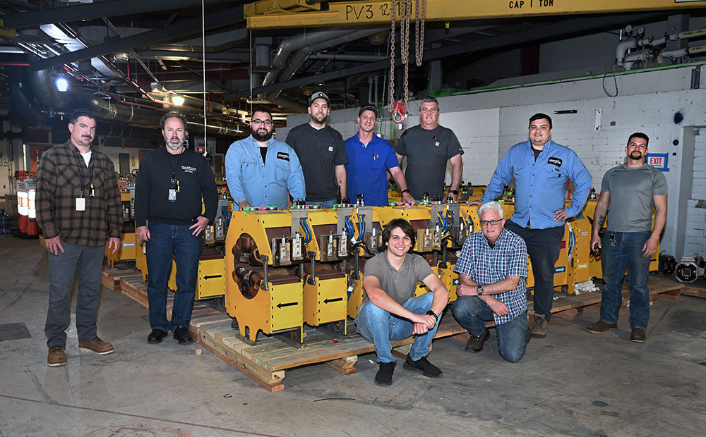 Technicians and engineers sit on magnets