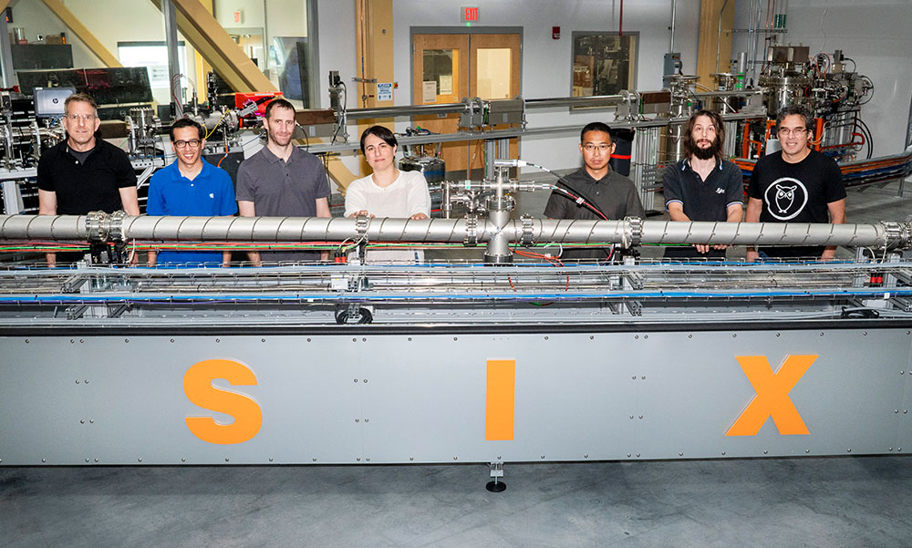 Group of seven scientists at the SIX beamline