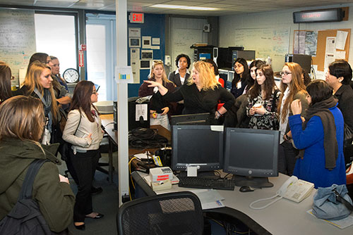 Brookhaven Lab physicist Elke Aschenauer in the STAR control room with a group of students