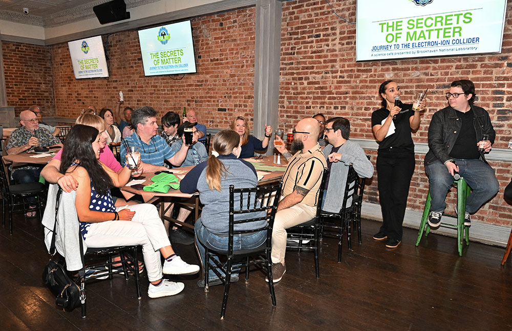 Kahille Dorsinvil and audience raise their glasses