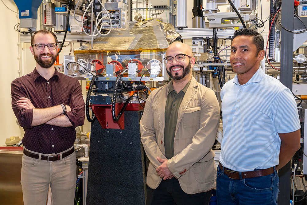 Steven Farrell, Juan Jimenez, and Sanjaya Senanayake stand at the Inner Shell Spectroscopy (ISS) bea