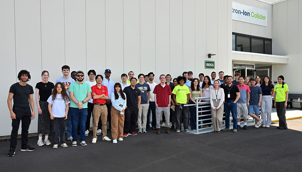 Interns pose for a group photo outside the EIC building