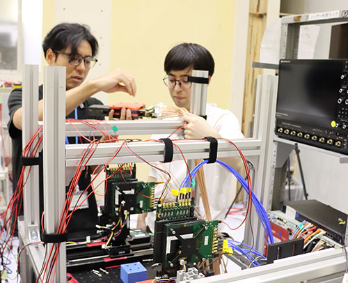 Researchers at the High Energy Accelerator Research Organization test prototype
