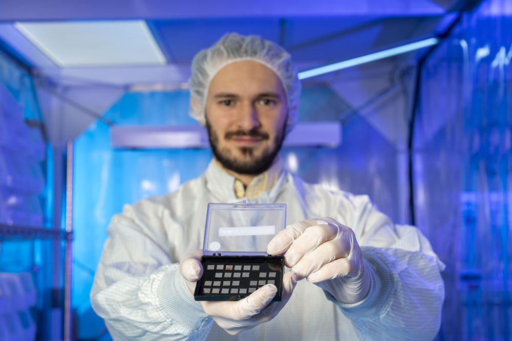 rancesco Crisa holds a series of superconducting qubits