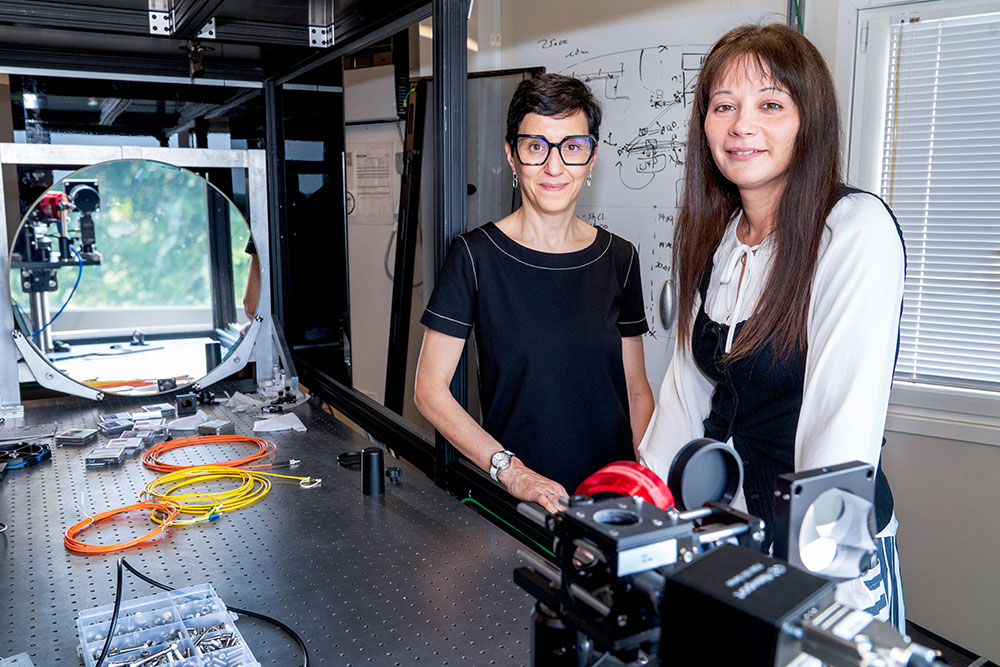 Gabriella Carini and Justine Haupt stand in Brookhaven's Quantum Lighthouse
