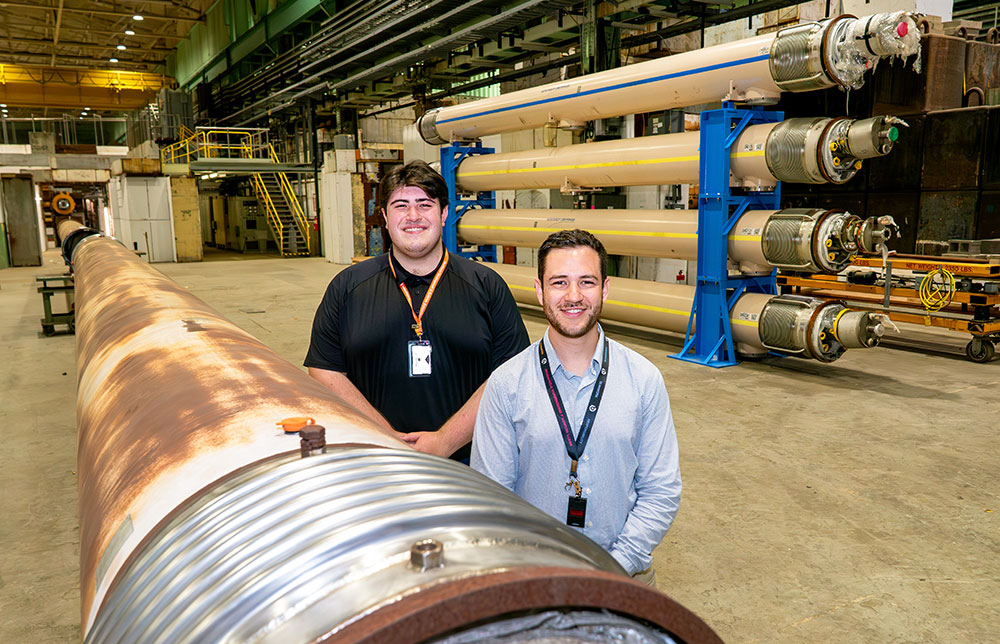 Summer intern Robert Desjardins, left, and his mentor, mechanical engineer Jonathon Greene
