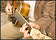 Picture of man playing guitar