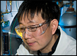 Brookhaven scientist Qiang Li loads a metal into a melt spinner, a crucial step in the synthesis of 