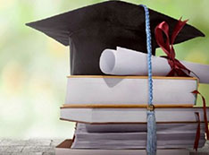 Graduation cap, diploma, books