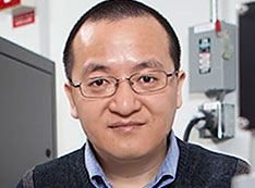 Photo of Guangwen Zhou in the Surface and Interface Laboratory at Binghamton University