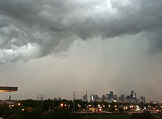 Photo of dark storm clouds over Houston skyline