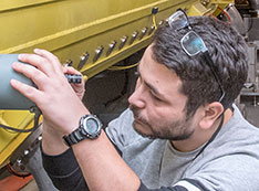 Photo of engineer performing maintenance on  the Brookhaven LINAC Isotope Producer