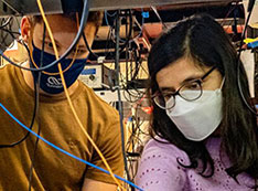 Photo of researchers in quantum information technology lab