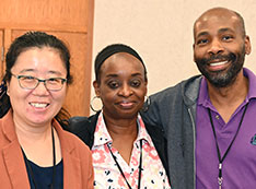 Images of meeting speakers and attendees cropped into hexagons