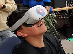 A young student uses virtual reality