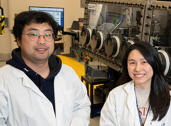 Houk Jang and Suji Park pose with the Q-Press at CFN