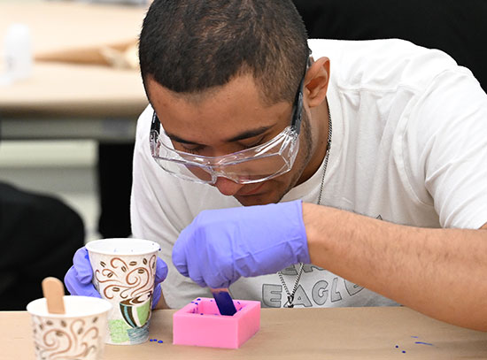 Students prepare cement mixture