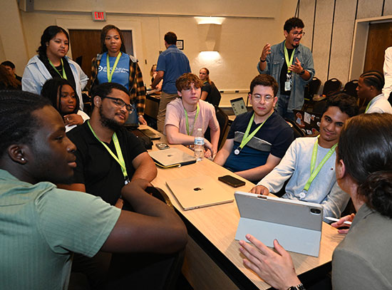 A group of nine students during a classroom discussion