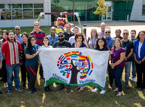 HHG group members at supporters pose with the group's flag