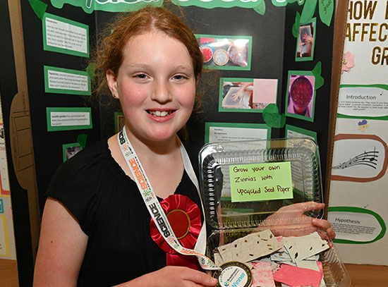 Lyla Drucker displays homemade seed paper