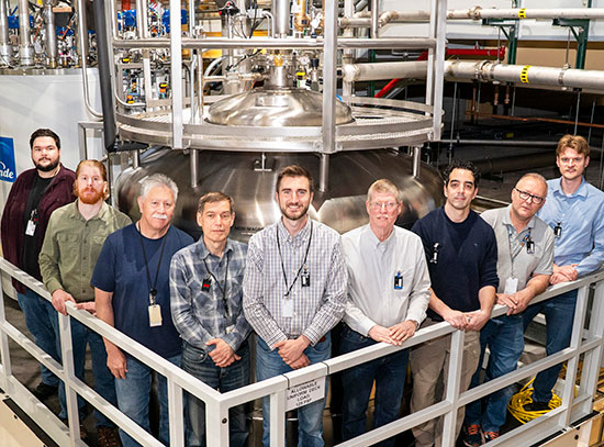 Members of the radiofrequency team with a newly installed cold box