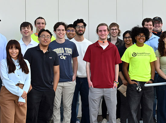 Interns pose for a group photo outside the EIC building