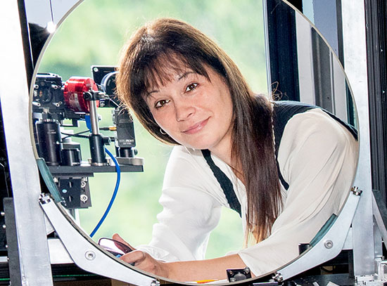 Justine Haupt looks in a mirror in the Quantum Lighthouse