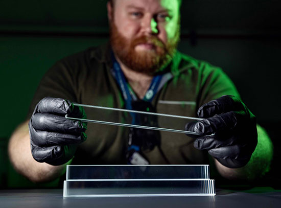 Joshua Crafts holds a lead-tungstate crystal