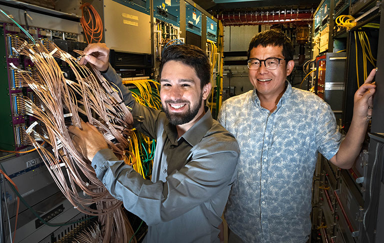 Daniel Brandenburg and Zhangbu Xu at the STAR detector
