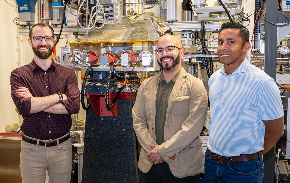 Steven Farrell, Juan Jimenez, and Sanjaya Senanayake stand at the Inner Shell Spectroscopy (ISS) bea