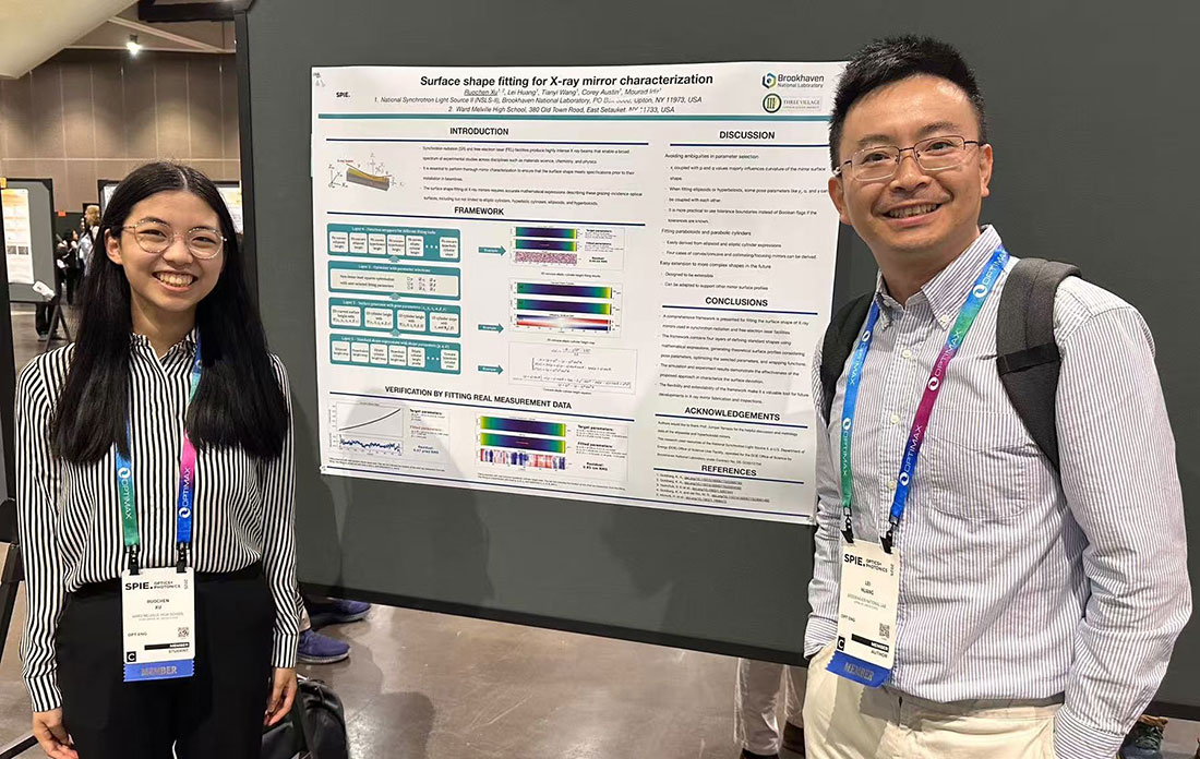 Ruochen (Racheal) Xu and Lei Huang display a poster