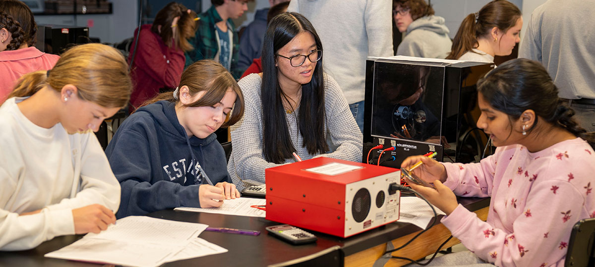 photo of female students with scientific hardware