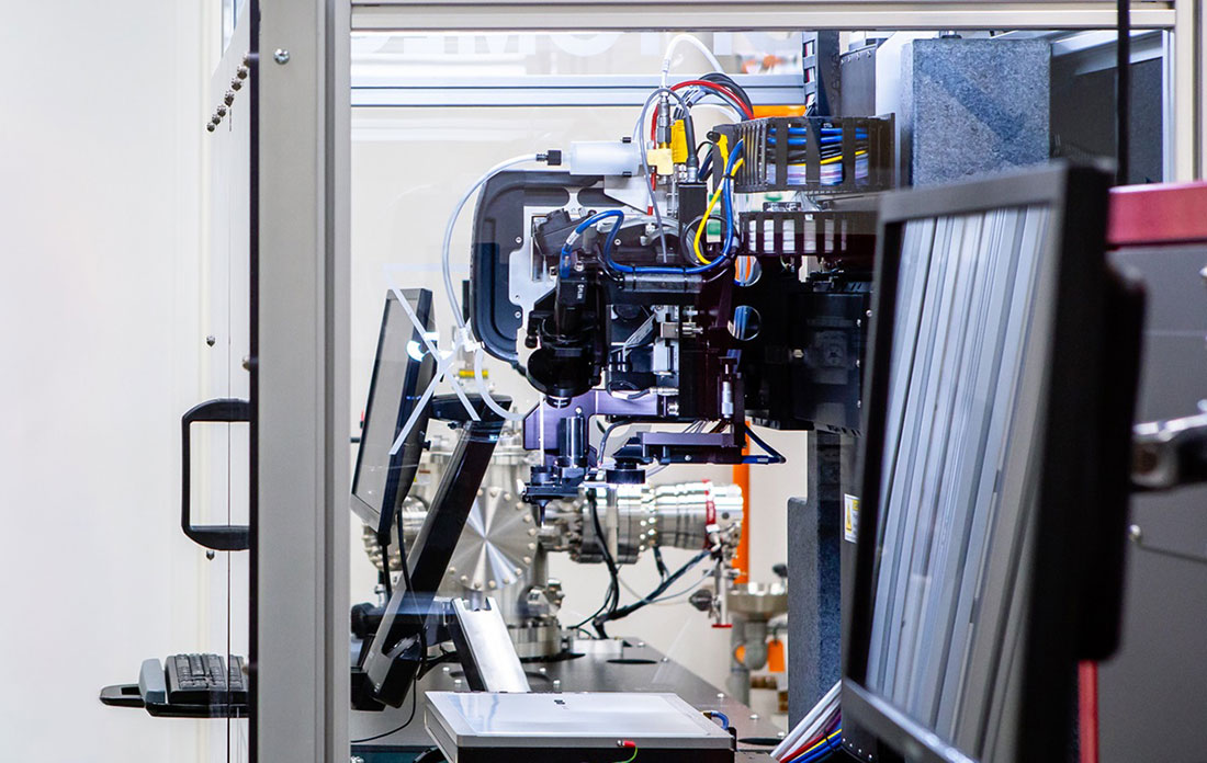 A close-up view of an aerosol jet printer at Argonne National Laboratory, showcasing its intricate c